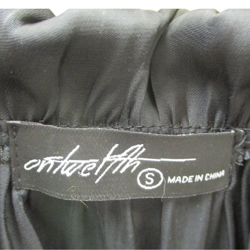 Beautiful black silky peasant blouse. Cute ruffle detail on top with neck tie. - Picture 4 of 7